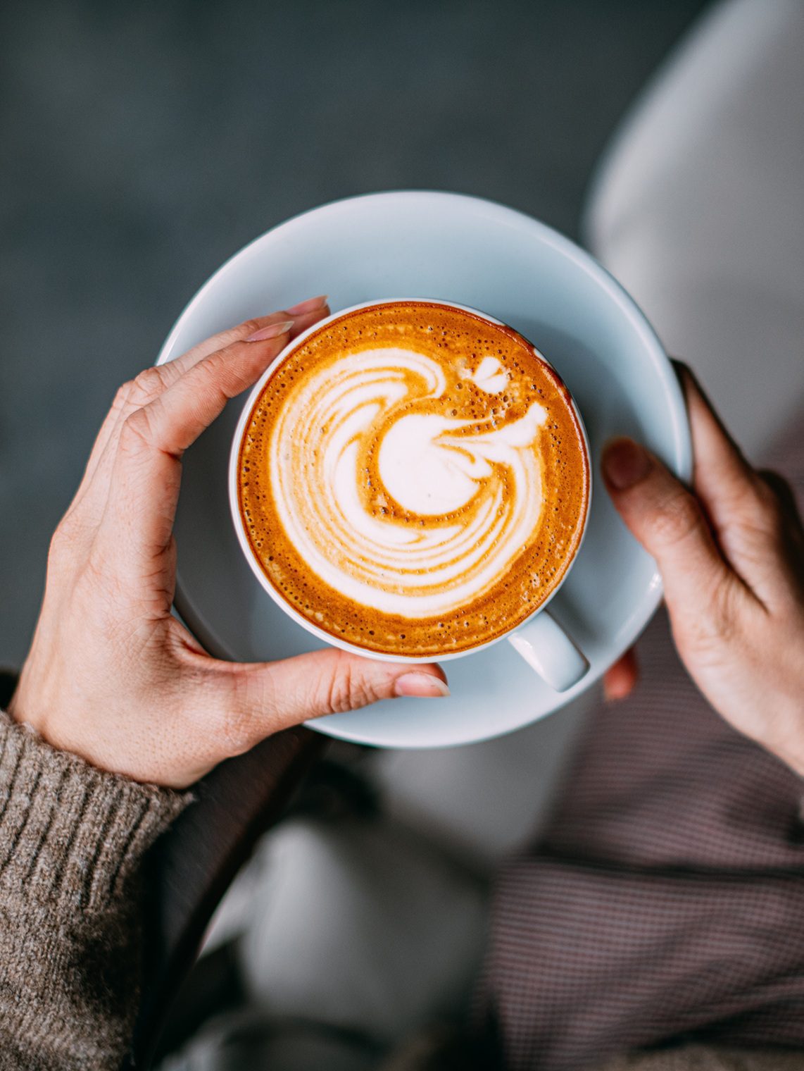 Latte art in a white coffee cup.